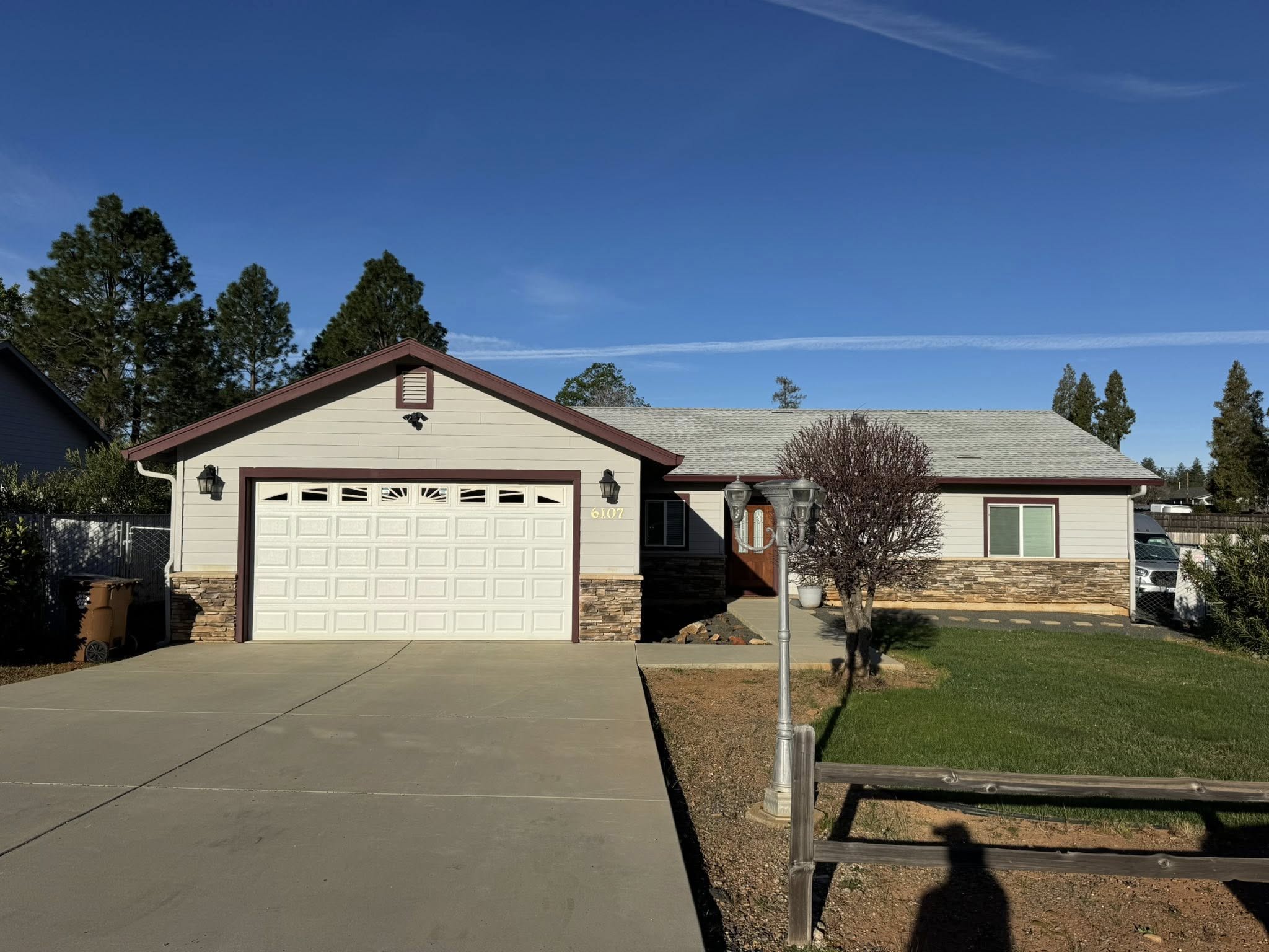 Front yard before curb appeal landscaping and driveway refresh